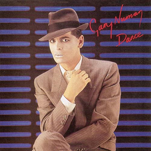 Gary Numan in a suit and hat, album cover for “Dance”.