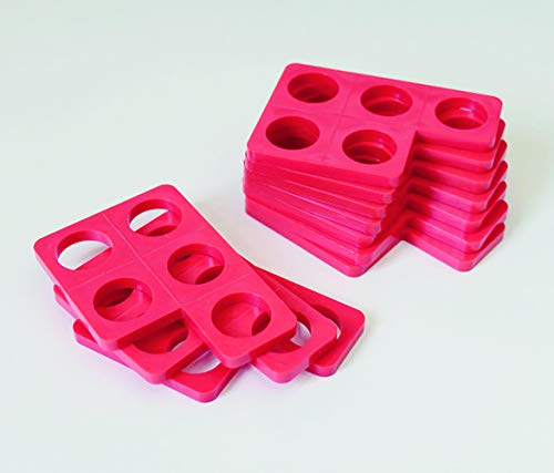 Ten pink Numicon shapes with five circular holes each.