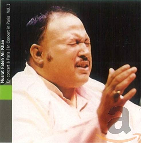 Close-up of Nusrat Fateh Ali Khan in a white shirt, eyes closed.