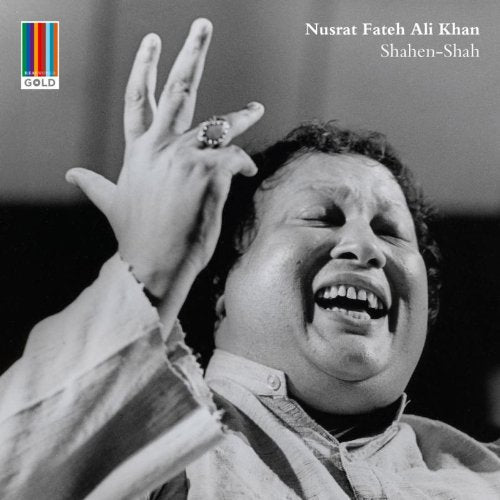 Black and white portrait of Nusrat Fateh Ali Khan singing with raised hand.