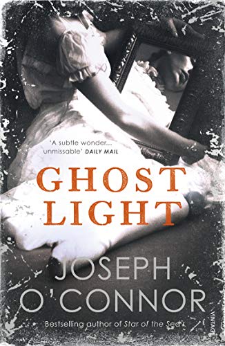 Book cover: "Ghost Light" by Joseph O'Connor, woman holding a mirror.