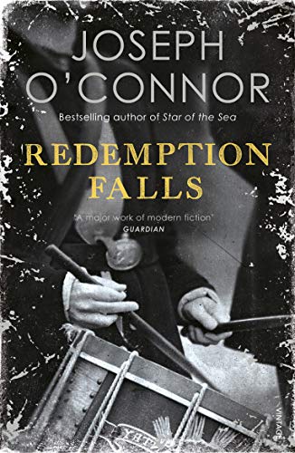 Book cover: "Redemption Falls" by Joseph O'Connor, featuring a man with a banjo.