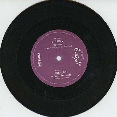 Black vinyl record with a purple label on a white background.