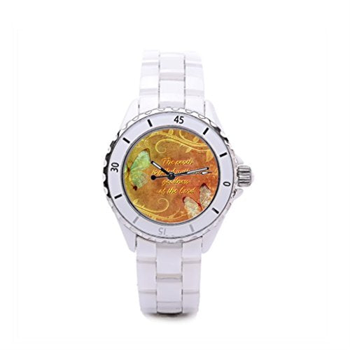 White wristwatch with a colorful, patterned face and silver-toned bezel.