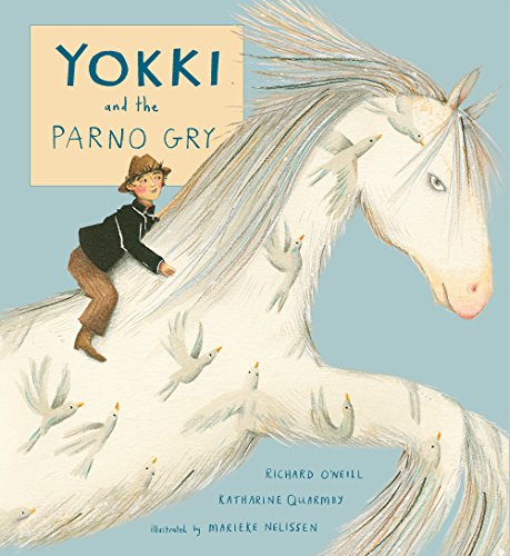 A boy in a hat rides a white horse surrounded by flying birds.