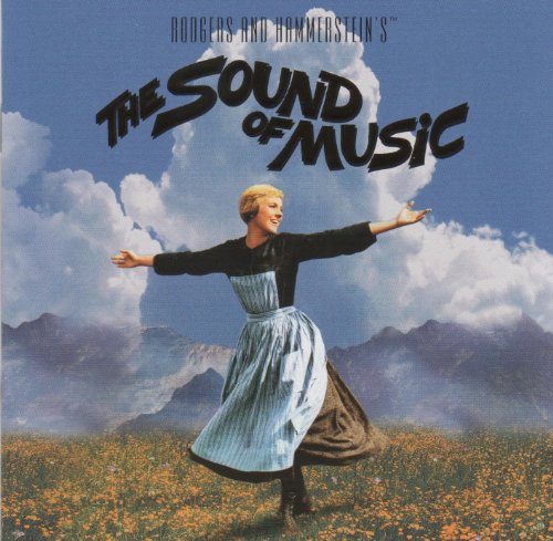 Maria spinning in a flowered meadow with mountains and clouds in the background.