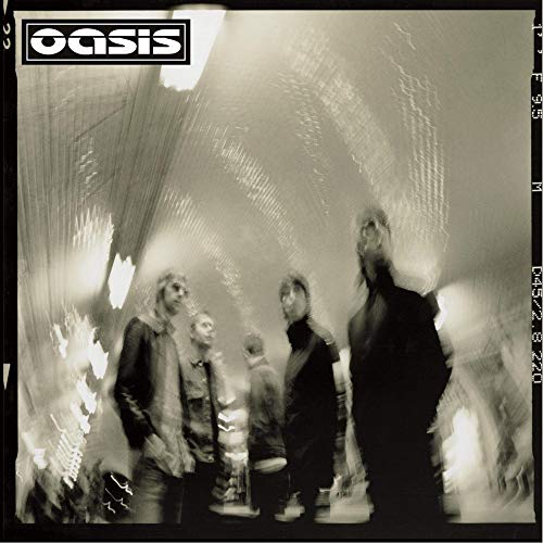 Oasis band members in a distorted, grainy black and white photo.