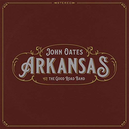 "Vinyl record cover with 'John Oates Arkansas' in ornate, silver font on maroon background."