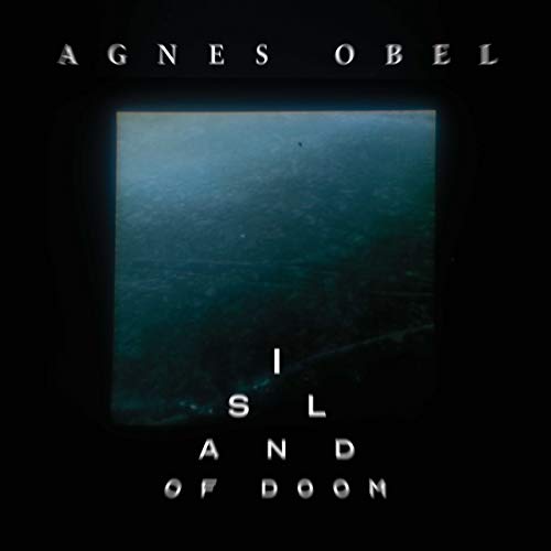 Agnes Obel's "Island of Doom" vinyl album cover, dark teal water scene.
