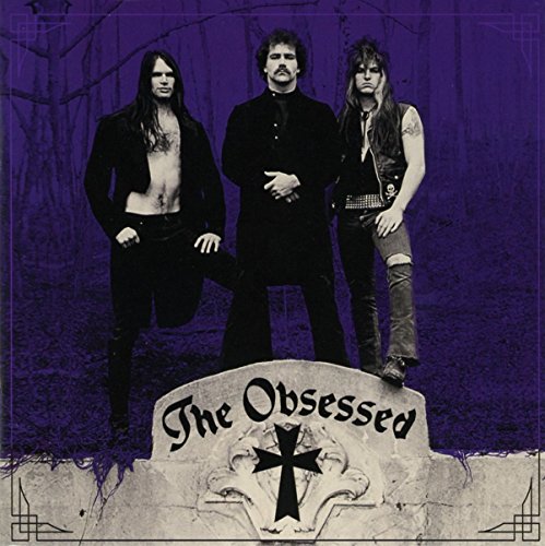 CD cover: three long-haired men in dark clothing before a forest.