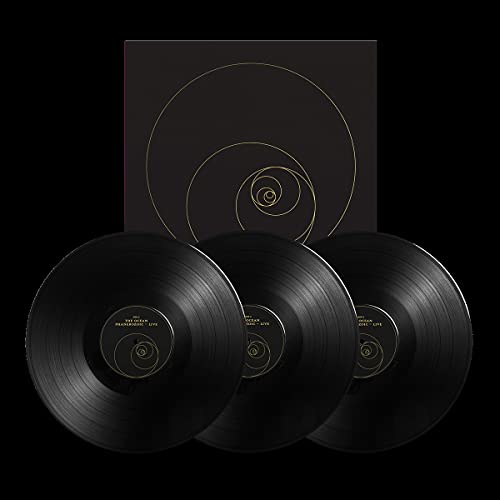 Black vinyl 3LP and DVD set with gold circular design.