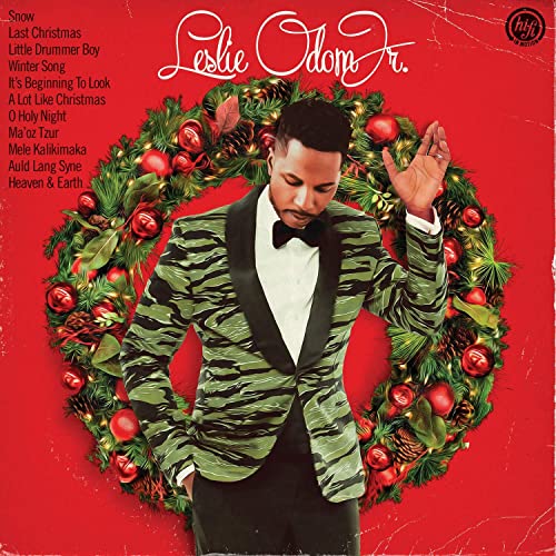 Leslie Odom Jr. album cover featuring artist in a green suit with wreath.