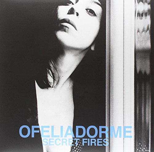 Black and white album cover with a woman’s face and blue text.