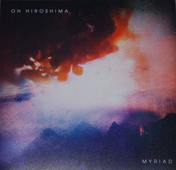 Vinyl record cover with abstract, blurred red and purple cloud imagery.