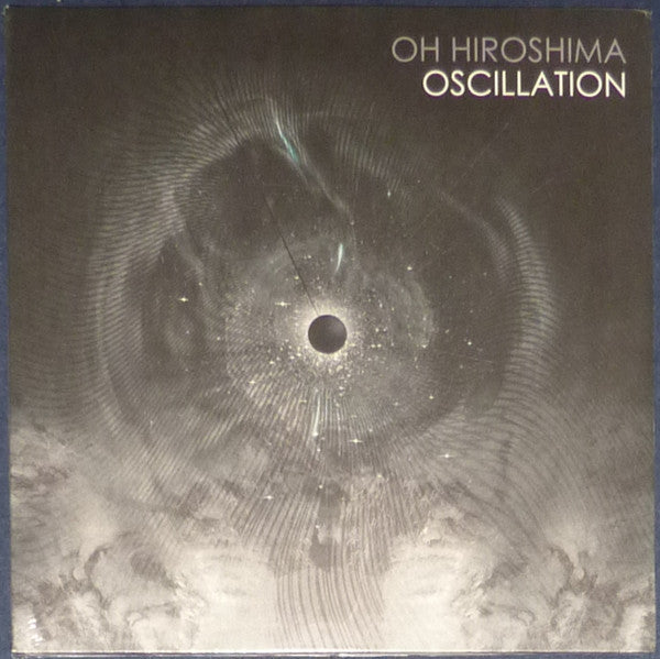 Vinyl record cover with abstract, swirling dark gray and black design.