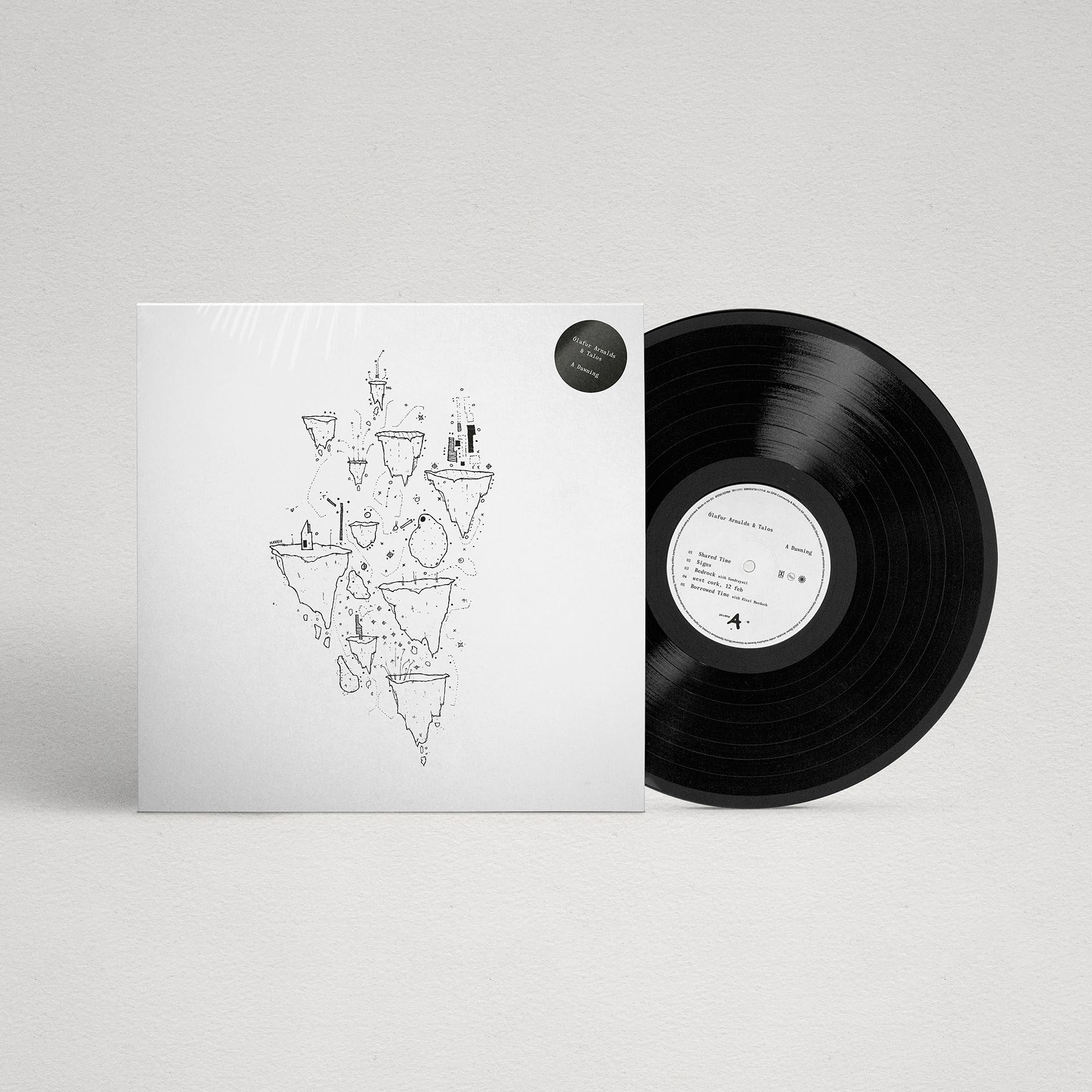 Vinyl record of Ólafur Arnalds’ “A Dawning” with sketched cover art.