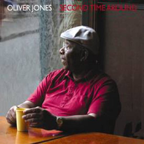 Oliver Jones album cover: man in red shirt and hat sitting at a table.