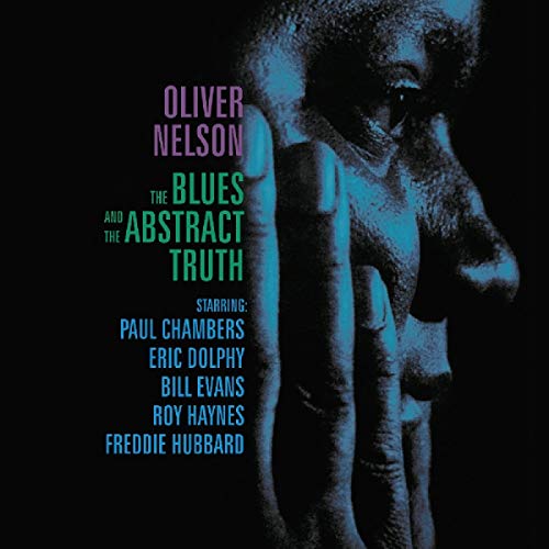 Album cover featuring a blue-toned portrait of a face and artist names on black.