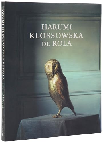 Book cover featuring a gilded owl perched on a draped table.
