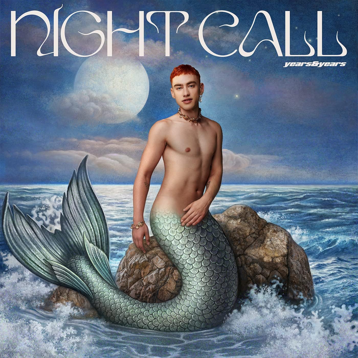 Olly Alexander as a merman, with a moonlit ocean background.