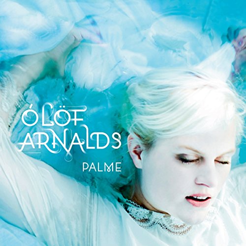 Woman with blonde hair floating in blue water, album cover.
