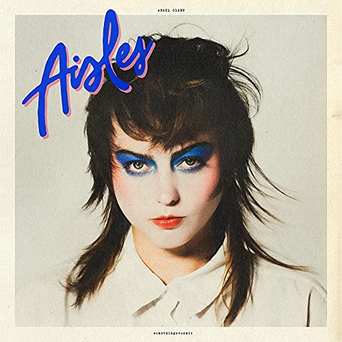 Record album cover featuring a woman with bold blue eyeshadow and hairstyle.