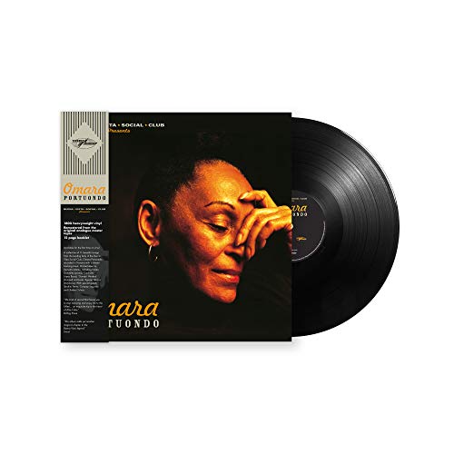"Vinyl record sleeve with a woman's portrait and partially visible black vinyl record."