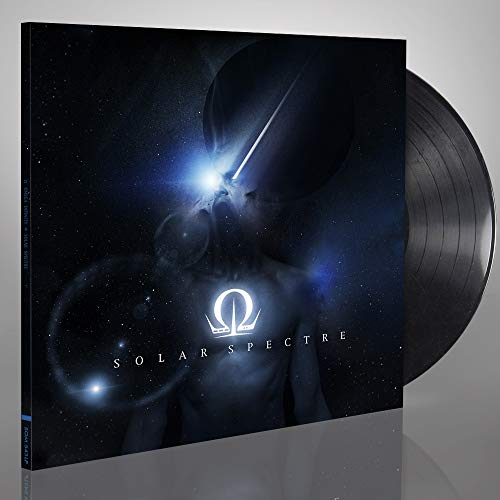 Dark album cover with a silhouetted face and cosmic imagery.