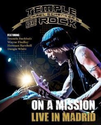 Guitarist playing onstage with bright lights and band member names listed.