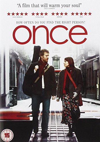 Couple walking hand-in-hand on a city street, movie cover for "Once".