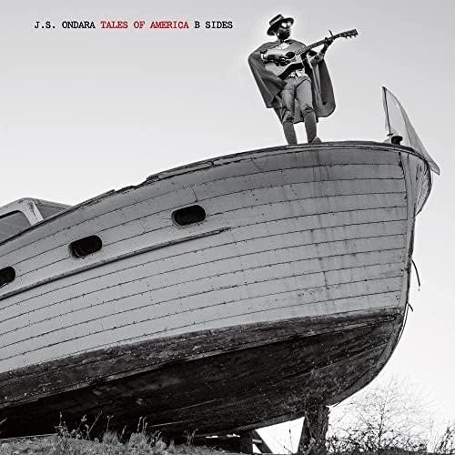 Black and white album cover featuring a musician on a boat.