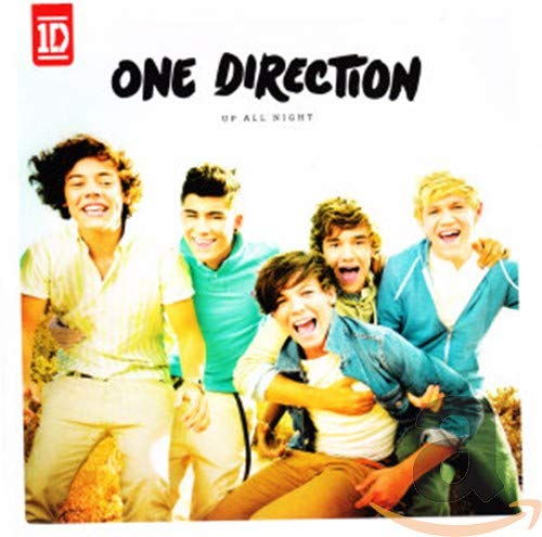 The five members of One Direction smiling together on their Up All Night album cover.