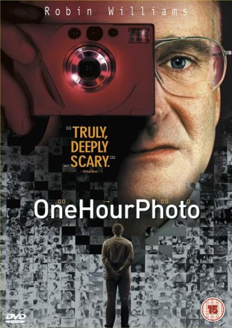 One Hour Photo" DVD cover featuring Robin Williams holding a camera.