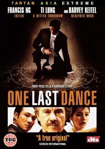 Man in suit on puzzle pieces with three people below, DVD cover for movie.