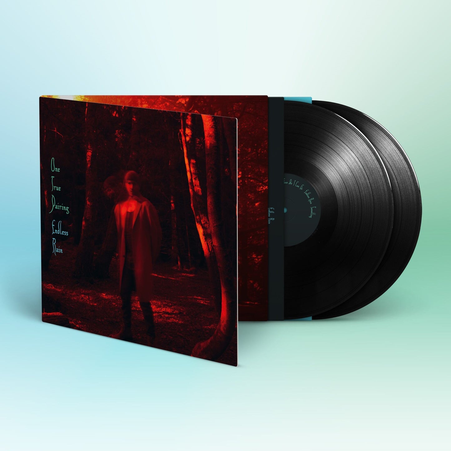 Vinyl record with cover art depicting a figure in a red forest.