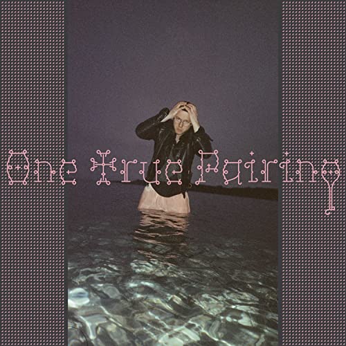 Vinyl record cover with a person standing in water, head in hands.