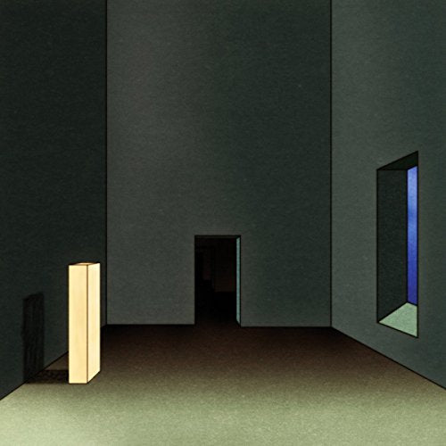 Dark, abstract interior with a glowing pillar and distant blue light.