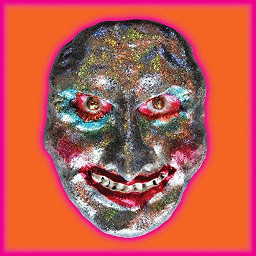 Sparkly, textured plastic mask resembling a human skull with red eyes.