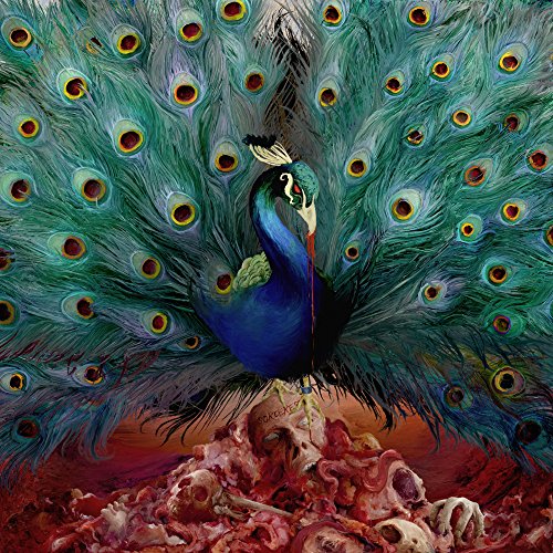 Painted peacock with spread tail, standing on skulls and bones.