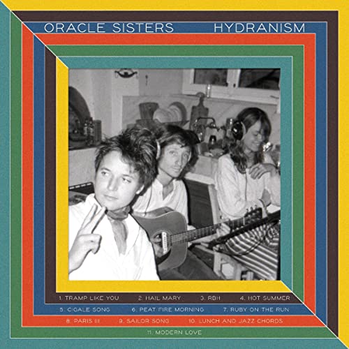 Vinyl record cover: black and white photo of three people with guitars.