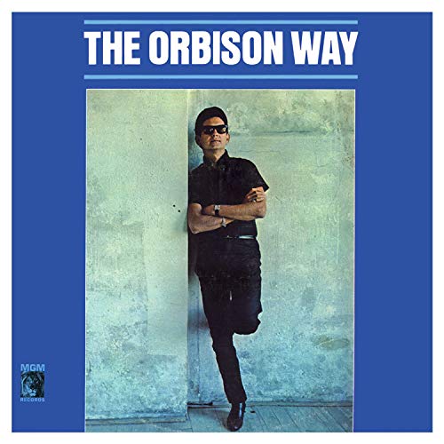 Roy Orbison album cover, black and white portrait, leaning against wall.