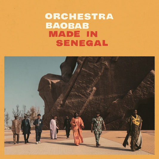 Album cover for Orchestra Baobab’s “Made In Senegal” featuring musicians and a monument.