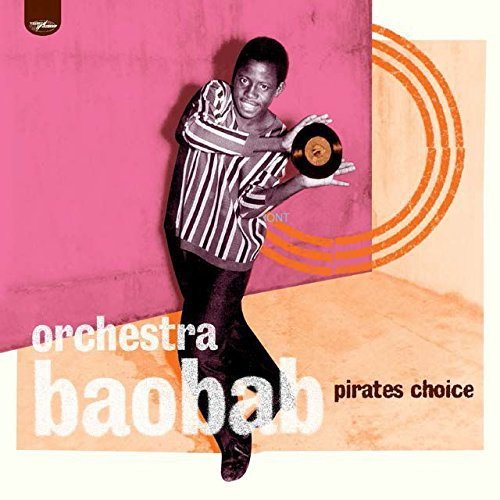 "Vinyl album cover featuring a man holding a record against a pink wall."