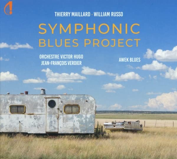 CD cover: vintage trailer in a grassy field under a blue sky.