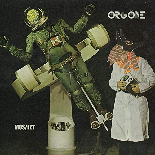 CD cover: astronaut and Anubis-headed figure with electronic equipment.