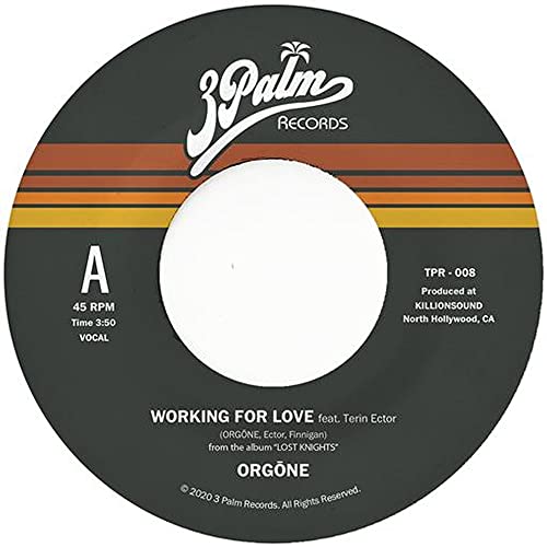 Black and orange vinyl record label with white center hole and text.