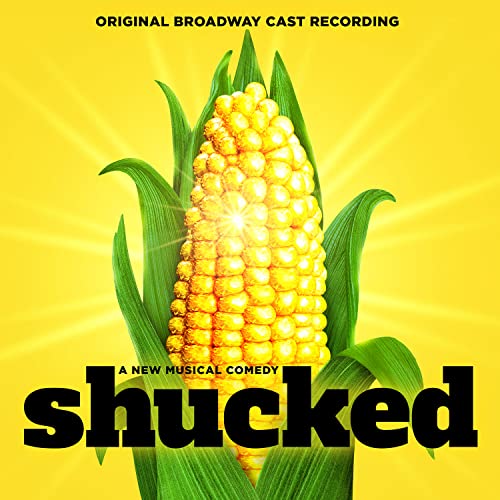 An ear of corn on a yellow background with the text Shucked.