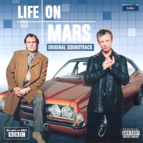 Two men stand in front of a vintage car on the Life on Mars soundtrack.