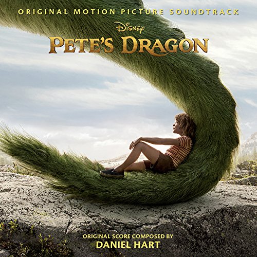 Boy sitting by a large, green dragon’s tail; movie soundtrack cover.