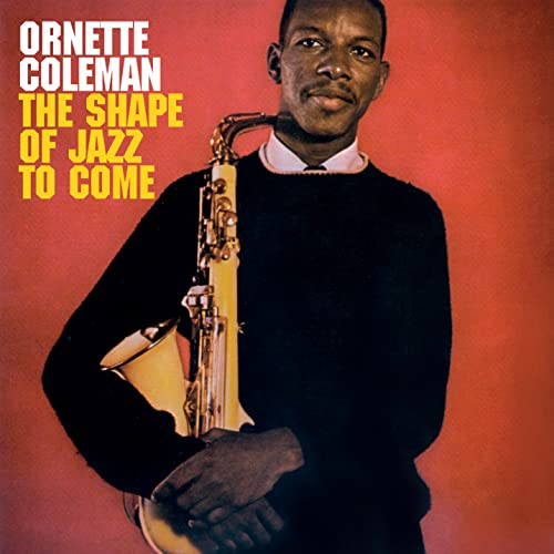 Ornette Coleman holding a saxophone on album cover, red background.
